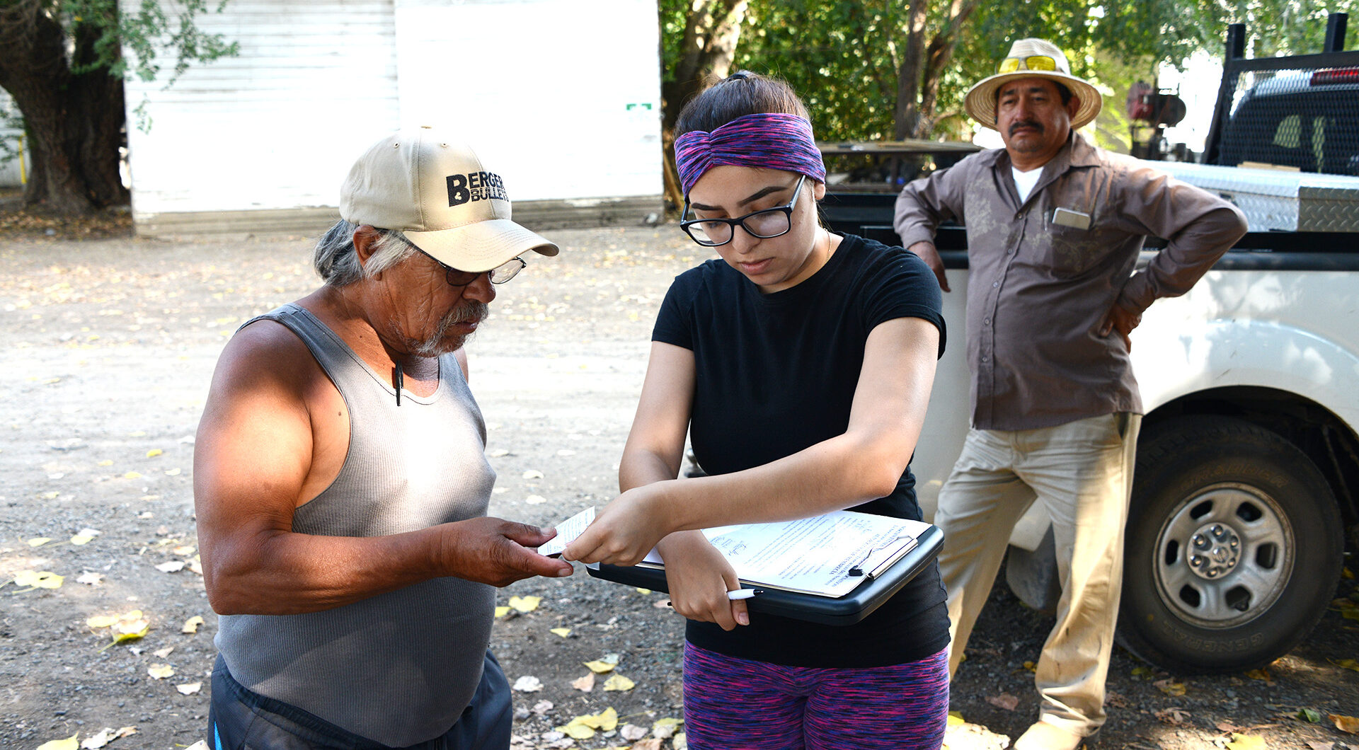 NSWA volunteer signs a new member on farm labor camp visit
